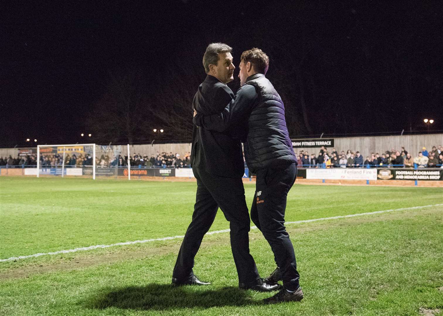 Tommy Widdrington - incandescent with rage - is held back by coach Mark Hughes after the final whistle at The Walks. Picture: Tim Smith (63137679)