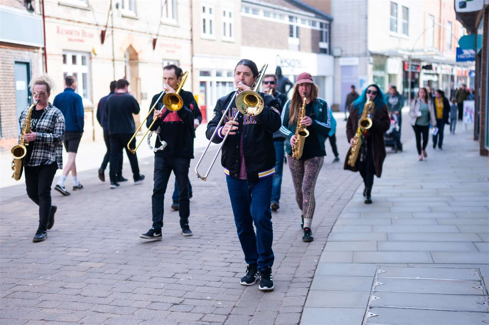 East Angles Brass Band performing through the streets