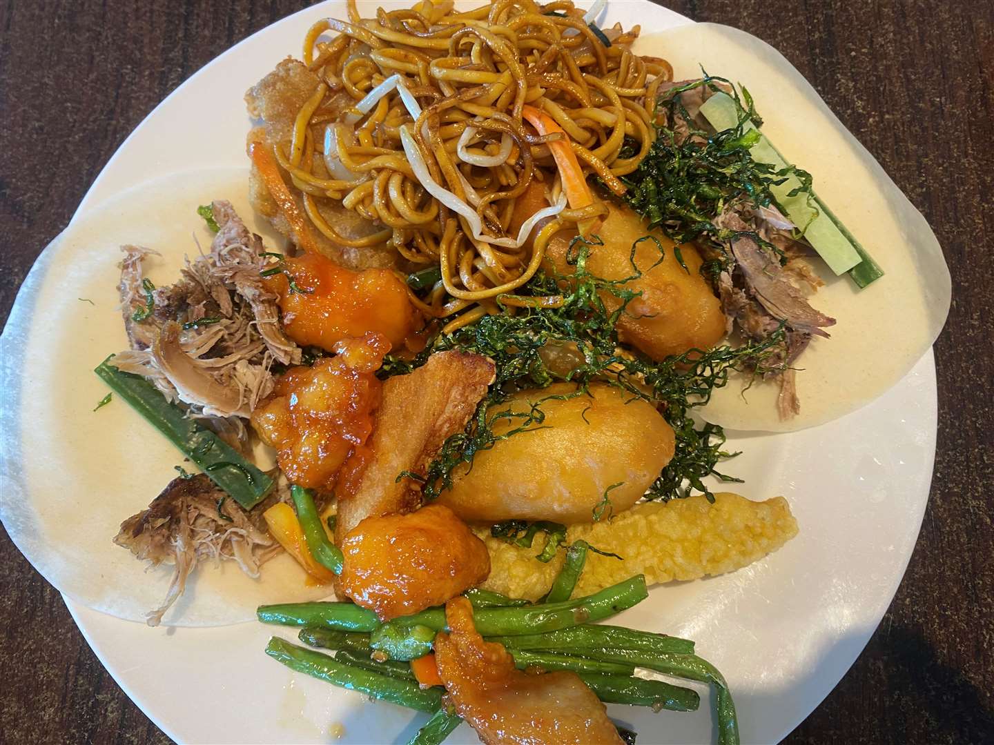 Brandon’s plate of food, featuring duck wraps, seaweed, chicken balls, chicken with Thai sweet chilli sauce, prawn toast and chow mein