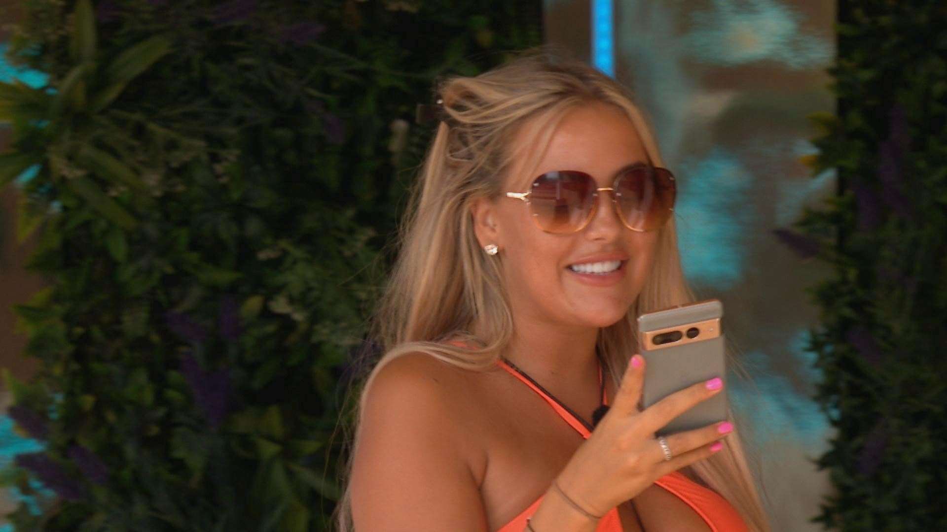 Jess reads out a text on Love Island. Picture: ITV