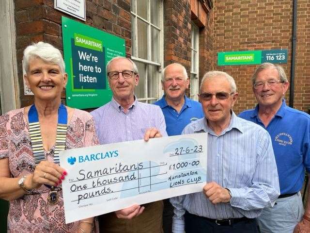 Pictured are three of the Hunstanton Lions team presenting the donation to Lynn Samaritans branch director David Conner (second left) and leadership team member Michael (second right)