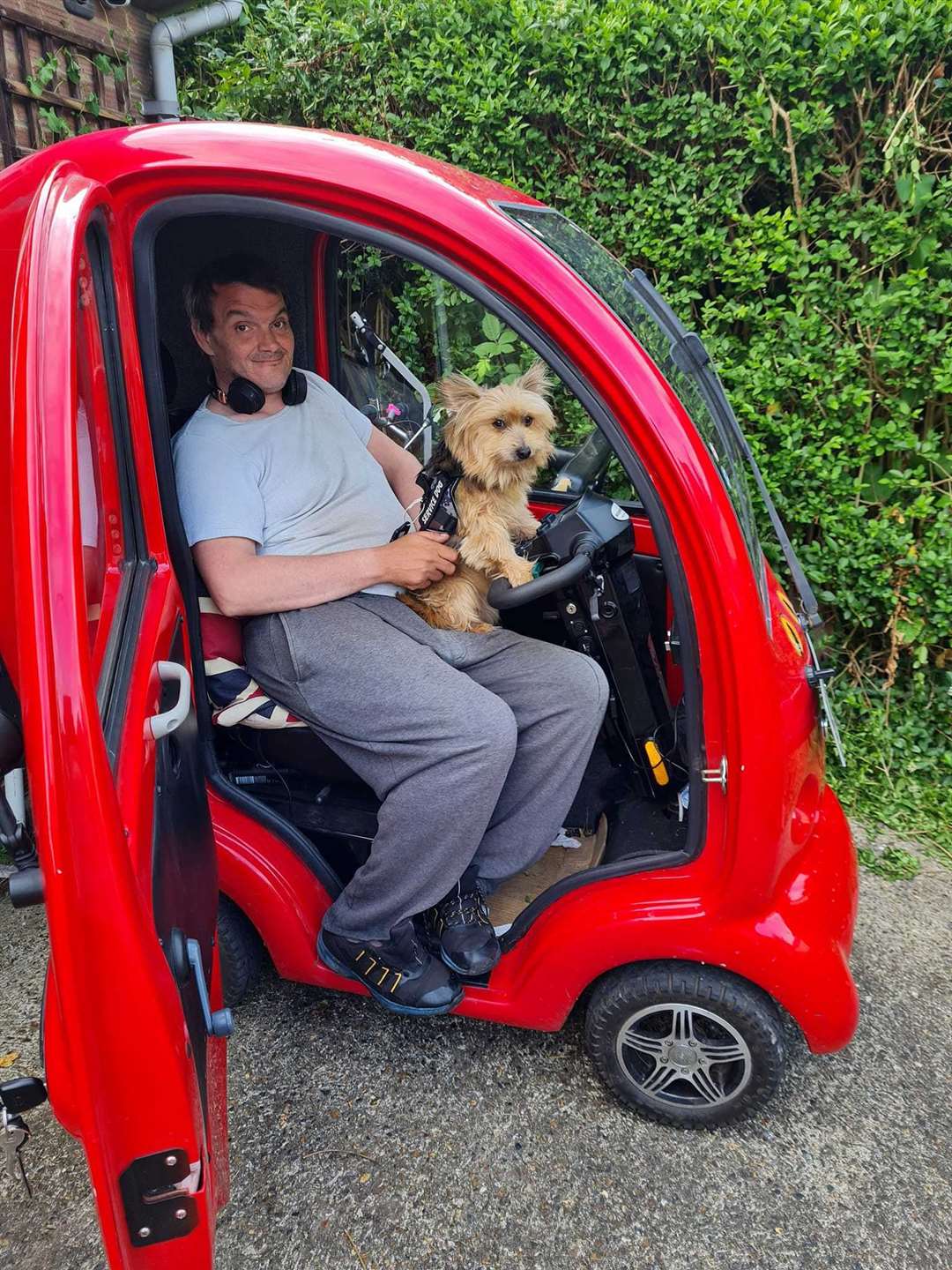 Jimmy Evans, of Wheelz Media, with his assistance dog Benny