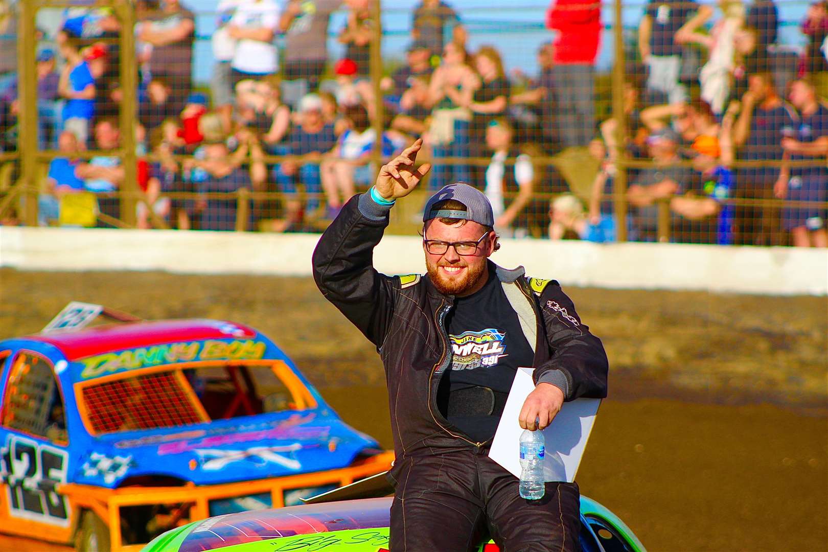 Jake Banwell takes the appreciation from his many local fans on his parade lap prior to competing in the 1300 Stock Car World Final on Saturday.