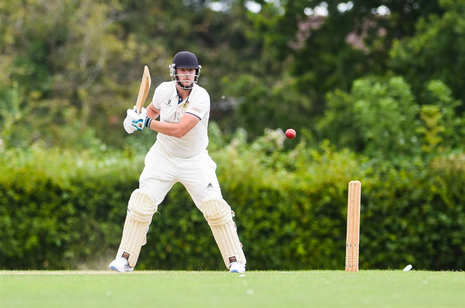 North Runcton batsman Ben Skipper watches his shot head to the boundary.