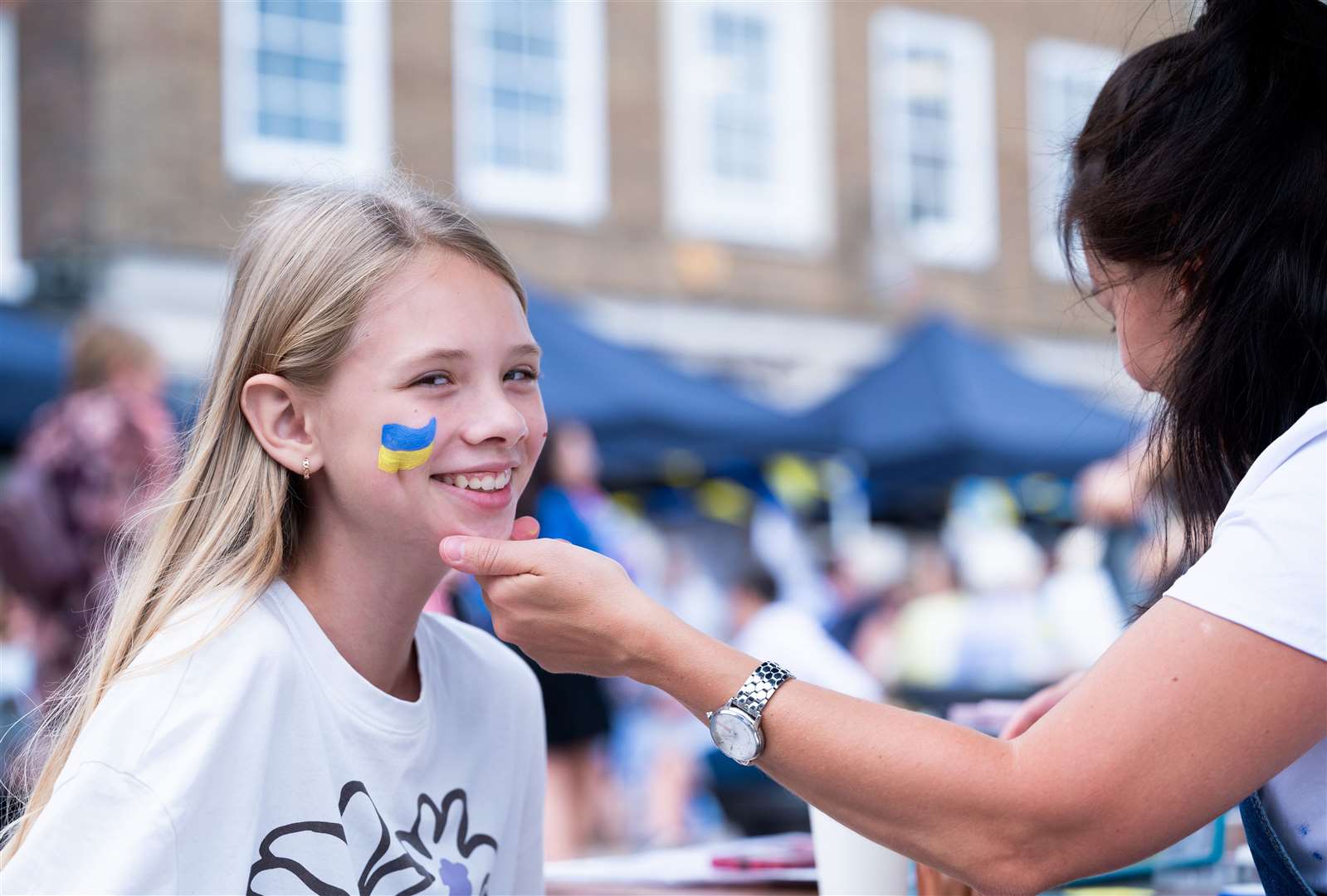 Many got their faces painted with the Ukraine flag. Picture: Ian Burt
