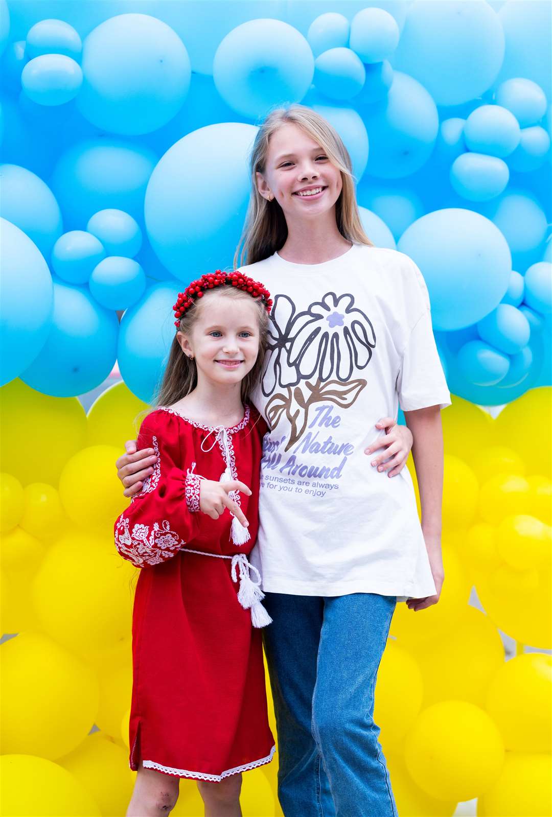 Many came for a picture outside of a balloon background in Ukraine colours. Picture: Ian Burt