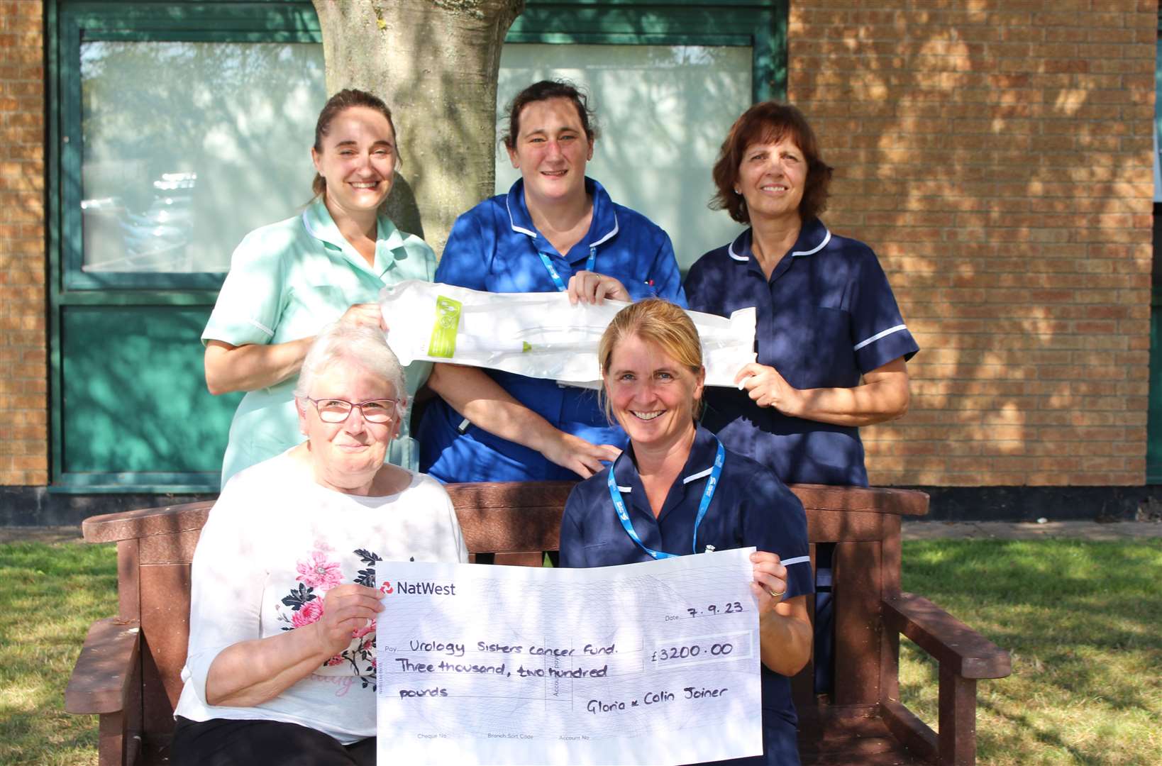 Gloria Joiner presents the cheque to urologic oncology charge nurse Claire Harvey. Also pictured are Michaela Harris Ann-Marie Knight and Sally Cook