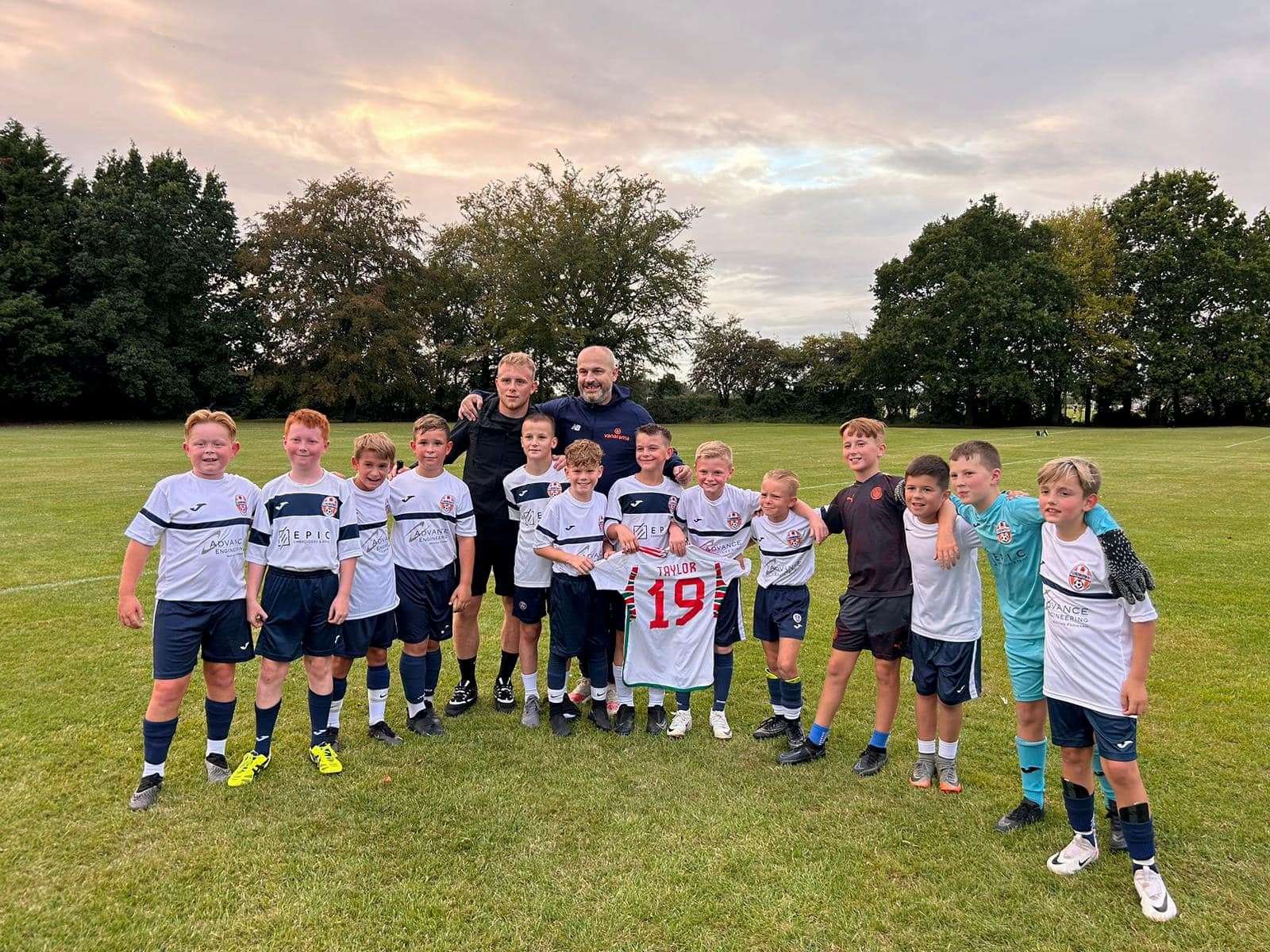 Joe Taylor with Under-11 footballers from Clenchwarton