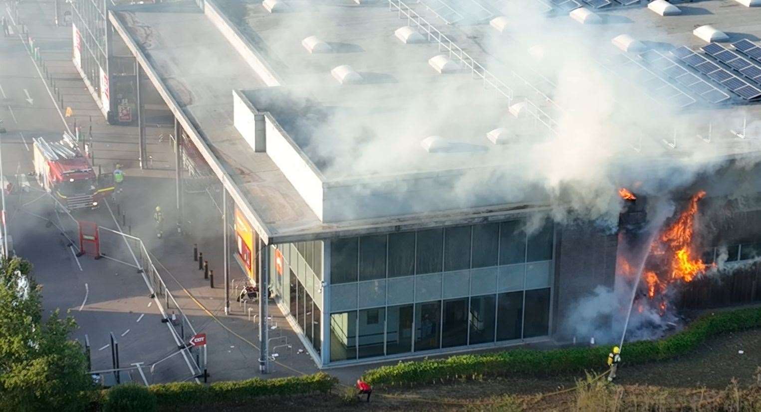 Firefighters tackling the blaze at Lynn's Hardwick Sainsbury's store in September. Picture: the drone people