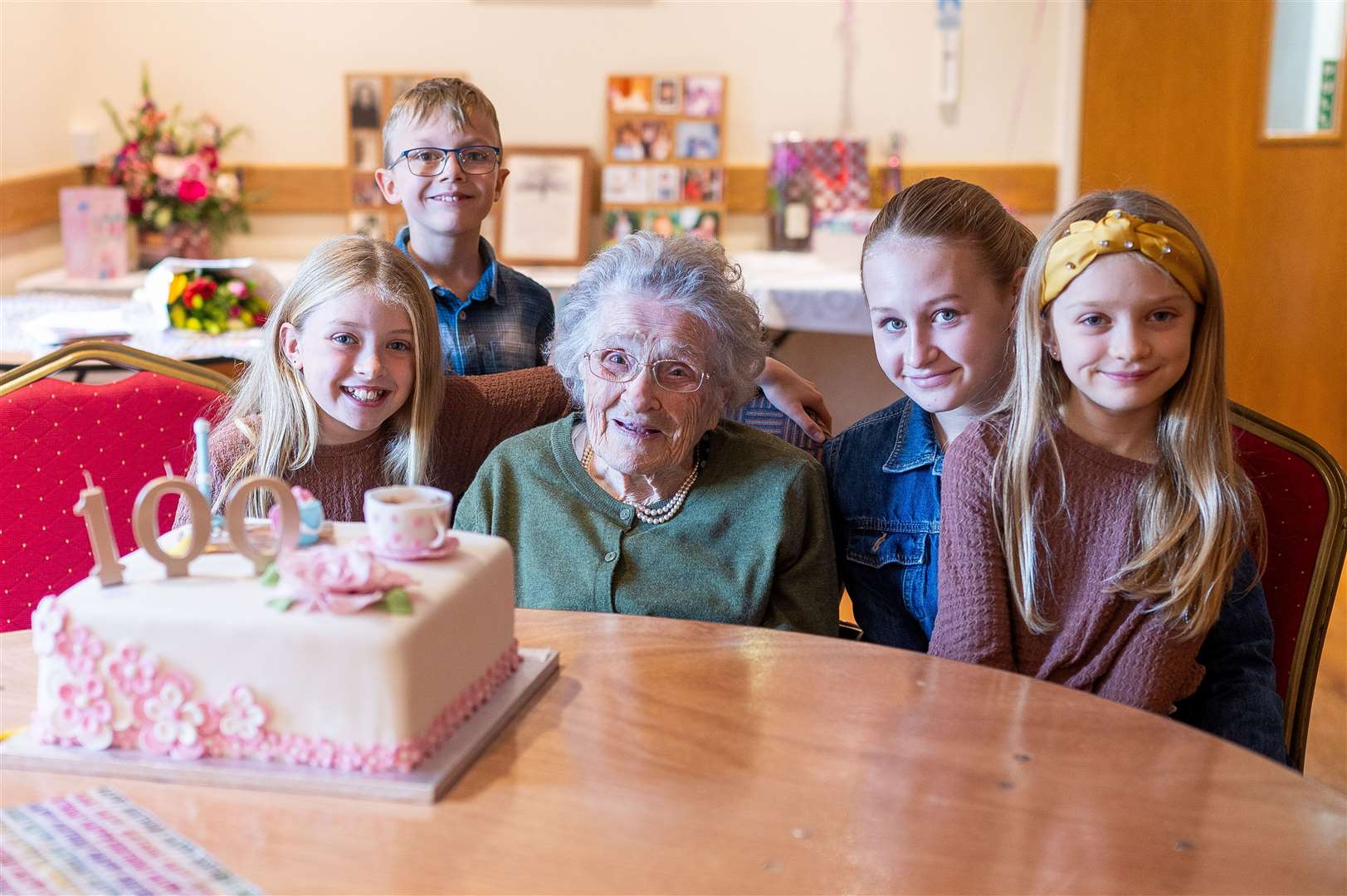 Edith Reed celebrating her 100th birthday with her great grandchildren