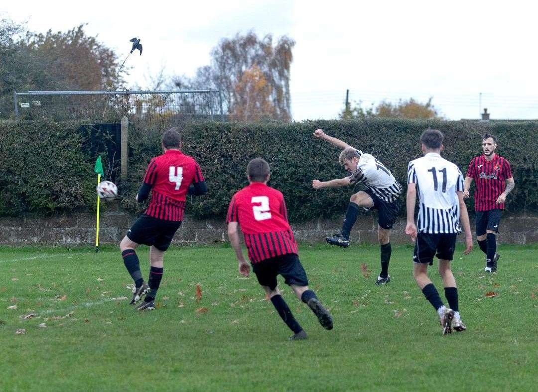 Harry Exley fires home Swaffham A's final goal against Rocklands and his third of the afternoon