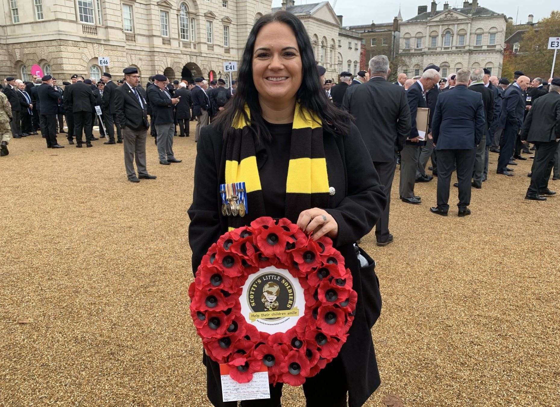 Founder, Nikki, holding the charity wreath which was placed at the Cenotaph (Picture: Scotty's Little Soldiers)