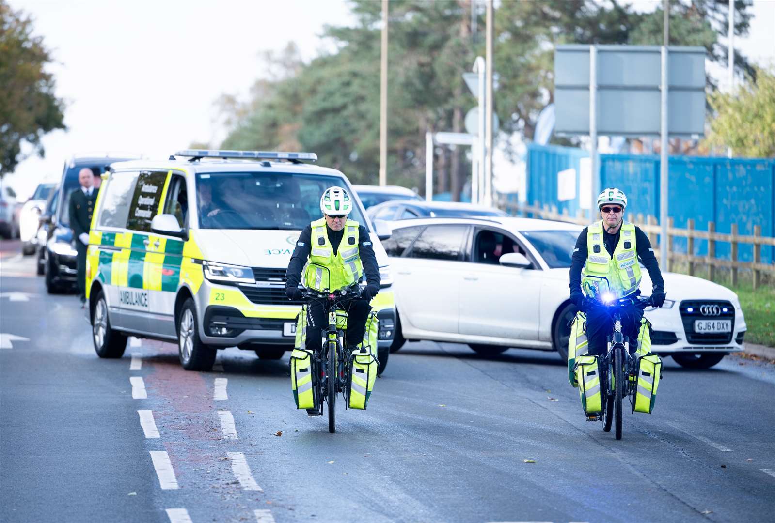 Ambulances headed through Gayton Road as part of the cortege. Picture: Ian Burt