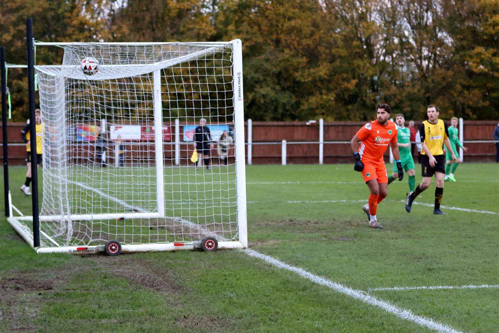 The Newport Pagnell goalkeeper watches Louis Henman-Mason's strike fly past him. Picture: Ronnie Heyhoe