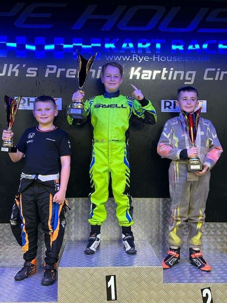 Jenson Sayell, 2023 Micromax London Cup champion, pictured in the centre with Alfie Mair, right, and Jenson Walker beside him.