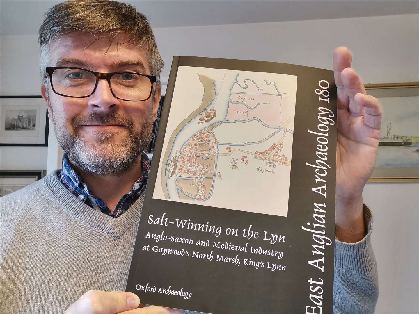 Graeme Clarke with the new book about salt-winning on Gaywood's North Marsh. Picture: West Norfolk Council