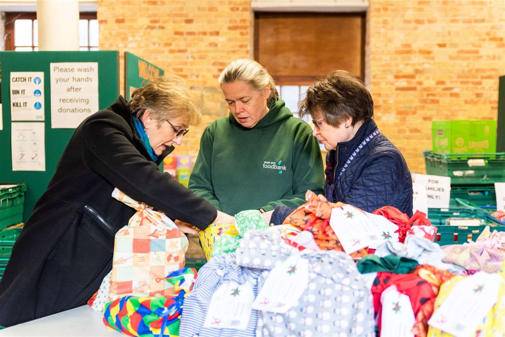 Helen Gilbert (centre), project manager at Lynn’s food bank, has seen ‘fear in the eyes’ of parents who are struggling to feed their children