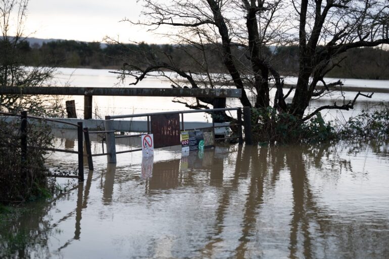 Flood warnings remain in place as cold weather alert issued