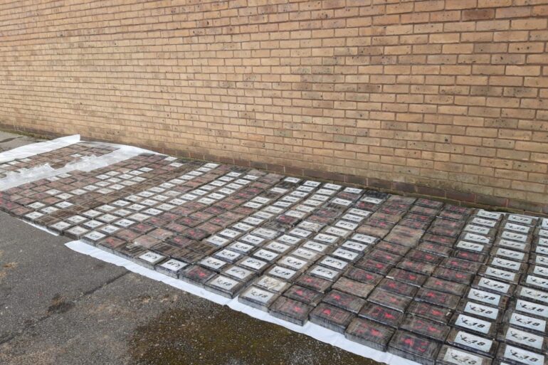 Four men charged after 500kg of cocaine seized in car park.