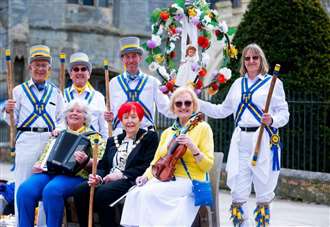 Morris dancers celebrate start of May with sunrise dance and parade in town centre
