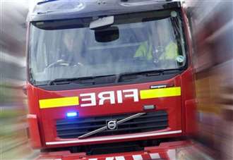 Crew tackles fire in the open on residential road