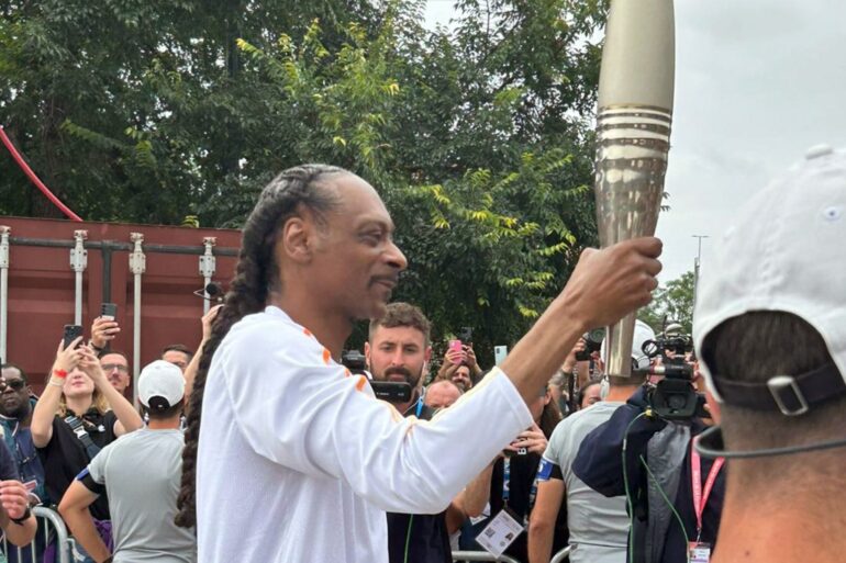 Crowds cheer as Snoop Dogg carries Olympic torch for Paris 2024 Games