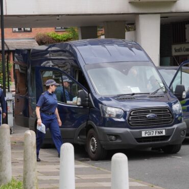 Man charged with murder over bodies found in suitcases as victims named