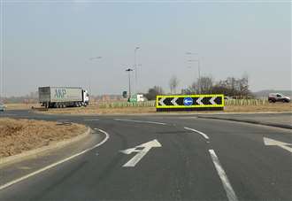 Woman taken to hospital following crash between car and lorry