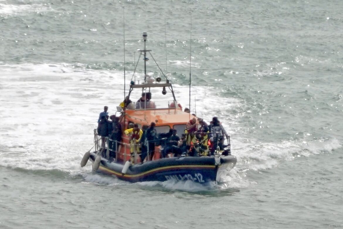 At least 13 dead after boat with dozens of migrants rips apart off French coast