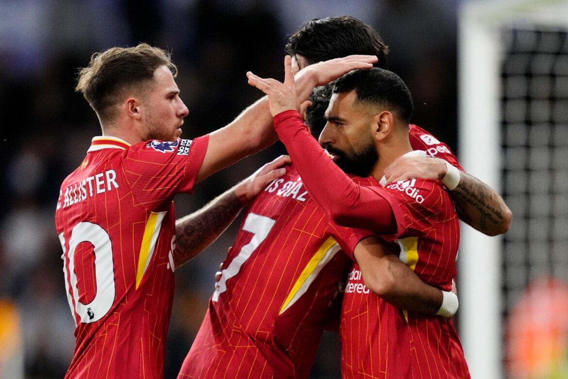 Liverpool go top of the Premier League after win at Wolves