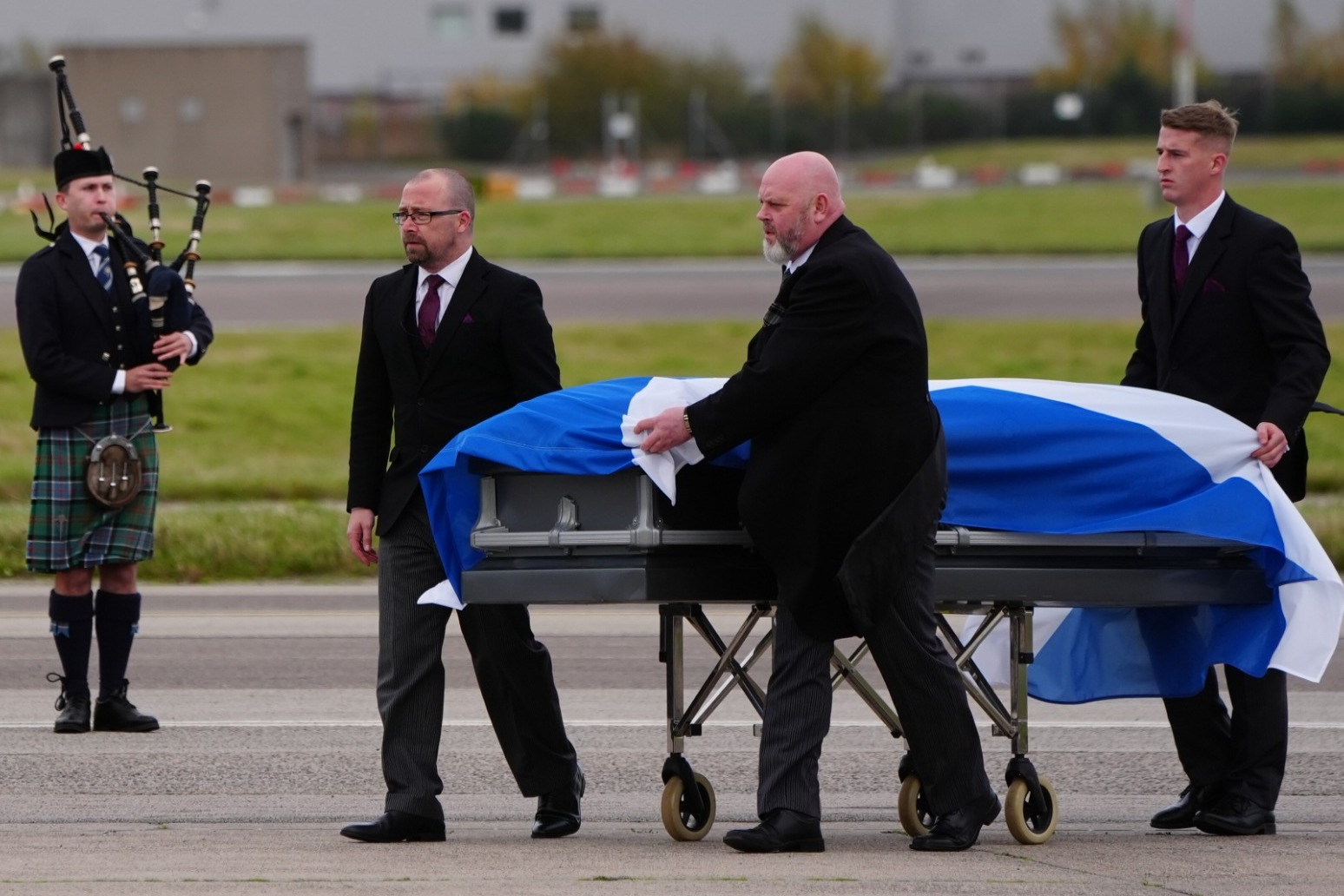 Alex Salmond’s body met by family and piper as plane lands in Aberdeen