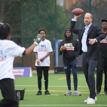 William shows off ‘unbelievable arm’ playing American football with youngsters