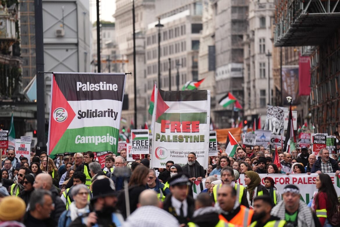 Pro Palestine group and counter protesters demonstrate near Christmas shoppers