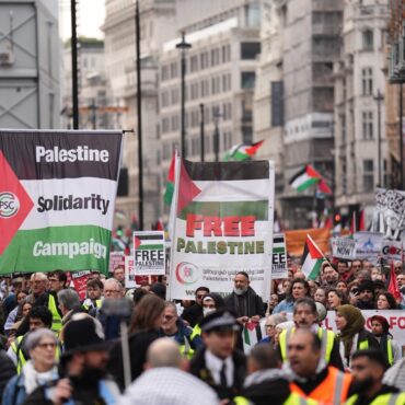 Pro Palestine group and counter protesters demonstrate near Christmas shoppers