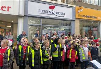 Children sing thanks to estate agent for paying for school Christmas dinner