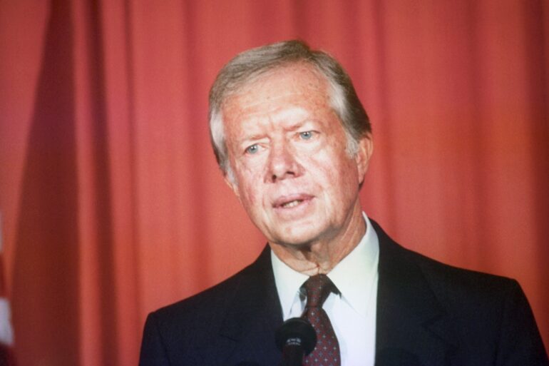 King and PM honour former US president Jimmy Carter after his death aged 100