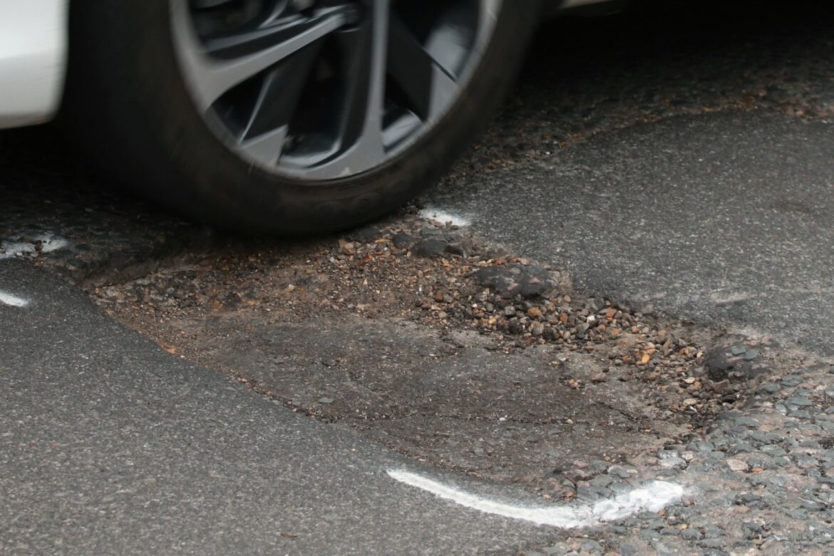 PM urges councils to get on with fixing broken roads