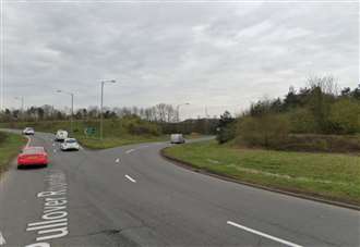 Police at scene of two-vehicle crash on roundabout