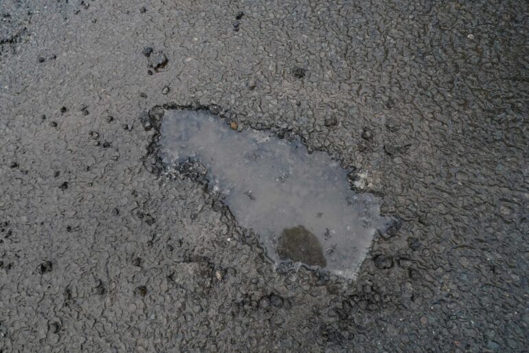 Commons committee chairman says local roads are riddled with potholes