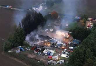 Tyre business temporarily shuts again after fire so scorched building can be removed