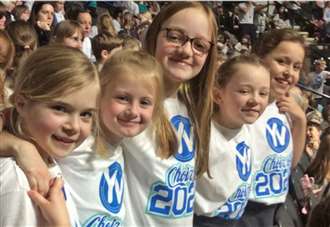 Primary school youngsters in fine voice at arena concert