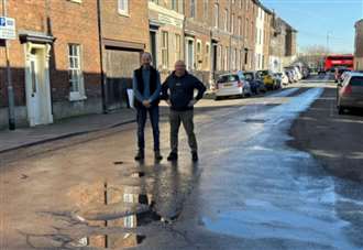 Business owners say that road ‘isn’t strong enough’ to keep coping with large amount of buses