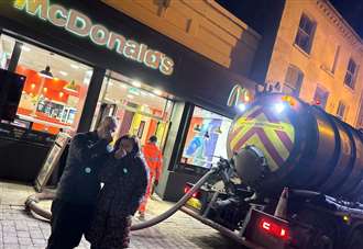 Passers-by hold their noses as sewer collapses outside McDonald’s