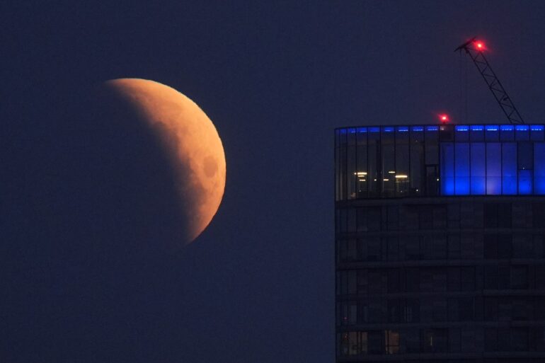 UK stargazers wake up to rare blood moon partial lunar eclipse