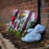 Floral tributes left at scene of house fire where mother and three children died