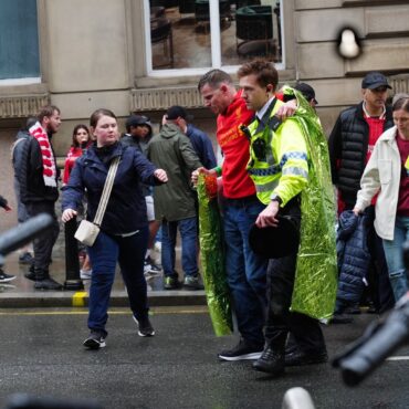 Man detained after car collides with pedestrians during Premier League parade