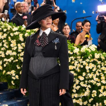 Rihanna debuts baby bump on star studded Met Gala blue carpet