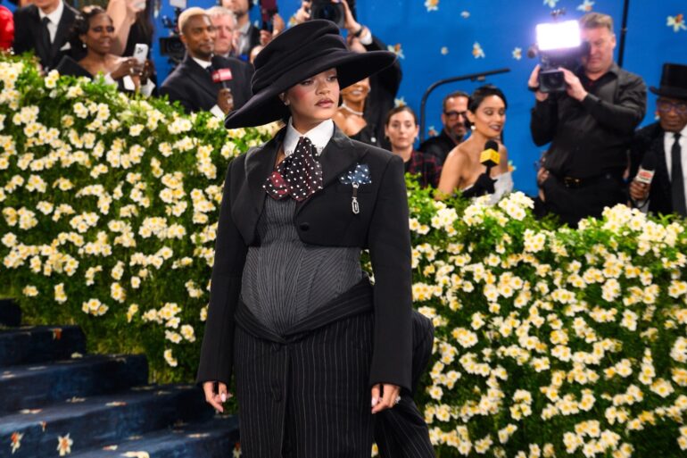 Rihanna debuts baby bump on star studded Met Gala blue carpet