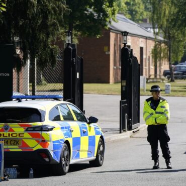 Two firefighters and a member of the public have died after a fire at a former RAF base in Bicester