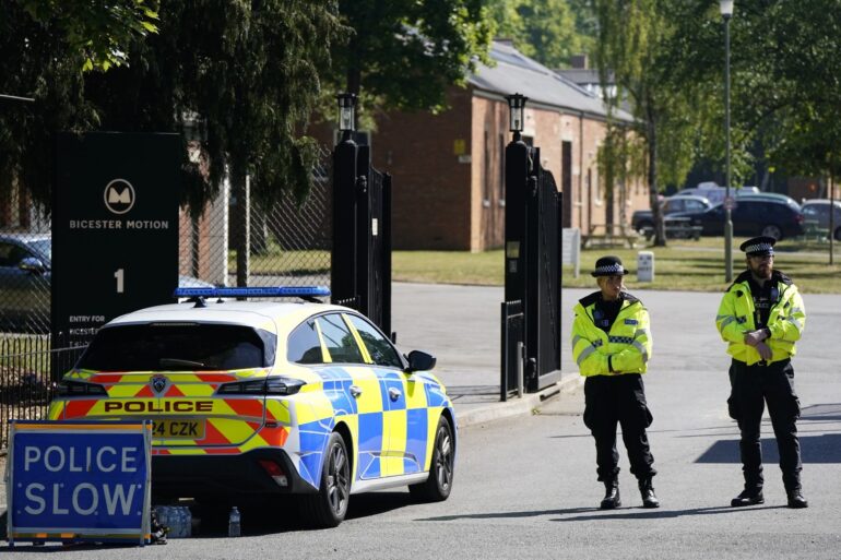 Two firefighters and a member of the public have died after a fire at a former RAF base in Bicester